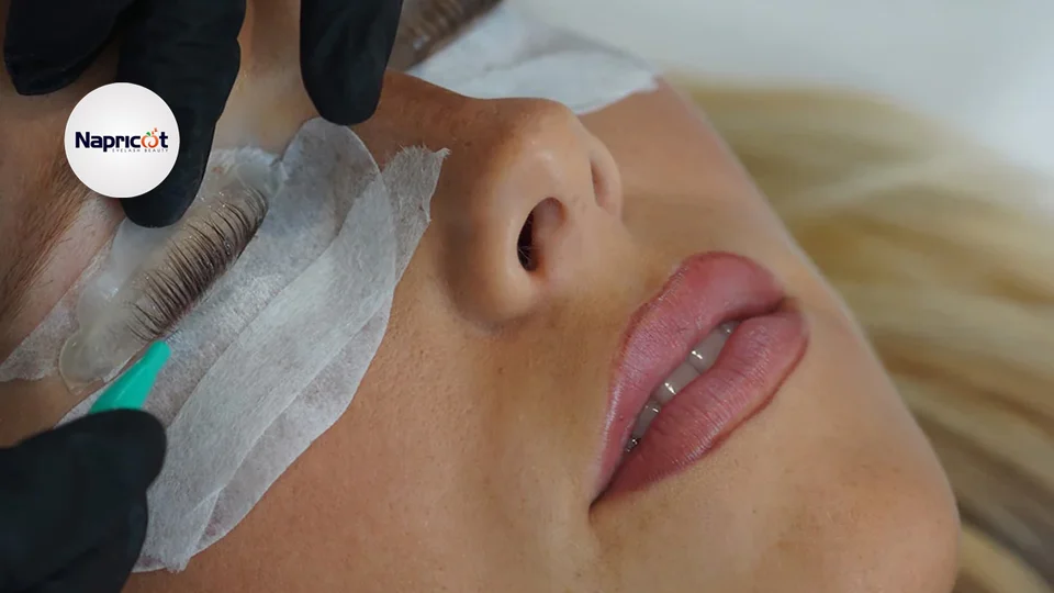 Licensed ophthalmologist examining patient's eyes for lash lift complications using professional equipment